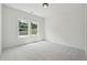 Bright bedroom with natural light, soft carpet, and a serene atmosphere at 3930 Clifton Hill Court #15, Cumming, GA 30040