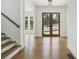 Open entryway with hardwood floors, leading to the dining and living area at 3930 Clifton Hill Court #15, Cumming, GA 30040