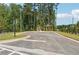 Shot of a paved area with two gazebos surrounded by green trees and manicured lawns at 3930 Clifton Hill Court #15, Cumming, GA 30040