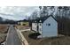 Shot of a two-story new construction home with black roof and freshly sodded yard at 3930 Clifton Hill Court #15, Cumming, GA 30040
