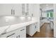 Bright kitchen with white countertops, and modern backsplash at 3930 Clifton Hill Court #15, Cumming, GA 30040