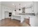 Modern kitchen with white cabinets, stainless steel appliances, and center island at 3930 Clifton Hill Court #15, Cumming, GA 30040