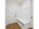 Inviting mudroom with built-in bench, storage, and coat hooks at 3930 Clifton Hill Court #15, Cumming, GA 30040