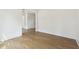 Empty room with hardwood floors, neutral walls, and natural light at 3930 Clifton Hill Court #15, Cumming, GA 30040