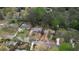 Aerial view of several houses, showing proximity to each other and surrounding tree cover in neighborhood at 493 James Street Sw, Lilburn, GA 30047