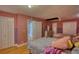 The bedroom has hardwood floors, closet space, and is decorated with two-tone walls at 493 James Street Sw, Lilburn, GA 30047