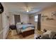 Comfortable bedroom with hardwood floors, ceiling fan, and a calming ambiance at 493 James Street Sw, Lilburn, GA 30047