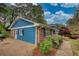 Charming home with a brick and siding exterior, showcasing a paved driveway and mature landscaping at 493 James Street Sw, Lilburn, GA 30047