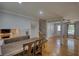 Bright living room with hardwood floors featuring a dining area and staircase at 493 James Street Sw, Lilburn, GA 30047