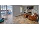 Comfortable living room with fireplace and adjacent sunroom or office space at 493 James Street Sw, Lilburn, GA 30047