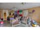 Unfinished storage room filled with clutter and assorted items with exterior access at 493 James Street Sw, Lilburn, GA 30047