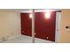 Basement room with a red accent wall and a support beam at , Marietta, GA 30008
