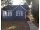 Charming single-story home with blue siding and white trimmed windows in a well-maintained yard at , Marietta, GA 30008
