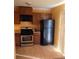 Well-lit kitchen features stainless steel appliances and beautiful flooring and black refrigerator at , Marietta, GA 30008