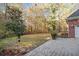 Lush backyard with mature trees provides a private and serene setting at 1418 Brighton Pl, Loganville, GA 30052