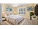 Bright bedroom with a comfortable king bed, white trim, and stylish decor at 1418 Brighton Pl, Loganville, GA 30052