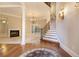 Bright foyer with hardwood floors, staircase, and decorative lighting at 1418 Brighton Pl, Loganville, GA 30052