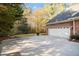 Spacious driveway leading to an attached two-car garage at 1418 Brighton Pl, Loganville, GA 30052