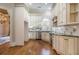 Beautiful kitchen with stainless steel appliances, granite countertops, and custom cabinetry at 1418 Brighton Pl, Loganville, GA 30052