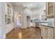 Gourmet kitchen with custom cabinetry, granite countertops, and stainless steel appliances at 1418 Brighton Pl, Loganville, GA 30052