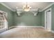 Bright room featuring neutral carpet, crown molding, and arched decor at 1418 Brighton Pl, Loganville, GA 30052