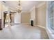Bright and airy living room featuring a cozy fireplace and elegant decor at 1418 Brighton Pl, Loganville, GA 30052