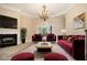 The living room features plush seating, fireplace, and neutral tones for a welcoming atmosphere at 1418 Brighton Pl, Loganville, GA 30052