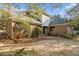 Home's rear exterior featuring brick and siding with a brick patio at 1418 Brighton Pl, Loganville, GA 30052