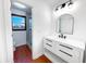 Bright bathroom with a modern vanity, updated fixtures, and a tiled shower at 144 Morning Creek Rd, Jonesboro, GA 30238