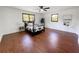 This bedroom has beautiful wood-look floors and an accent wall at 144 Morning Creek Rd, Jonesboro, GA 30238