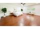 Spacious bedroom with wood-look floors, two windows and decorative chair seating at 144 Morning Creek Rd, Jonesboro, GA 30238
