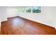 The finished room features three windows and new floors at 144 Morning Creek Rd, Jonesboro, GA 30238
