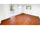 Finished room showcasing wood-look flooring, natural light, and outdoor access at 144 Morning Creek Rd, Jonesboro, GA 30238