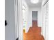 Hallway view showing wood-look floors and white doors leading to rooms at 144 Morning Creek Rd, Jonesboro, GA 30238
