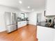 Spacious kitchen with stainless steel appliances, black countertops, and wood-look flooring at 144 Morning Creek Rd, Jonesboro, GA 30238