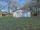 Exterior view of the shed, set in a spacious grassy lot at 144 Morning Creek Rd, Jonesboro, GA 30238