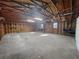 Spacious shed interior with wooden walls, concrete flooring, and exposed rafters at 144 Morning Creek Rd, Jonesboro, GA 30238