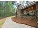 A spacious backyard with an outdoor kitchen, fireplace, and spa offering ample space for outdoor living and entertaining at 2251 Everleigh Ln, Marietta, GA 30064