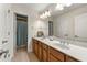 Bathroom features a double sink vanity with white countertop and lots of light fixtures for illumination at 2251 Everleigh Ln, Marietta, GA 30064