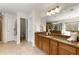 Bright bathroom with double sinks, granite countertops, and a glass shower stall at 2251 Everleigh Ln, Marietta, GA 30064