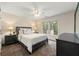 Bedroom featuring neutral walls, carpet, and a large window allowing for lots of natural light to shine through at 2251 Everleigh Ln, Marietta, GA 30064