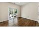 Bedroom features hardwood floors, neutral walls, sliding glass doors to the backyard and ample natural light at 2251 Everleigh Ln, Marietta, GA 30064