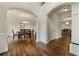 Elegant dining room featuring hardwood floors, a tray ceiling, and archway into foyer at 2251 Everleigh Ln, Marietta, GA 30064