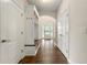Bright entryway featuring built-in storage, coat hooks, and beautiful hardwood floors at 2251 Everleigh Ln, Marietta, GA 30064
