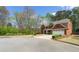Lovely traditional home with a brick facade, complemented by a spacious, well-maintained lawn at 2251 Everleigh Ln, Marietta, GA 30064