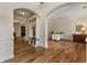 Open foyer with hardwood flooring, arched entryways and built-in storage off the office at 2251 Everleigh Ln, Marietta, GA 30064
