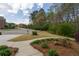 Landscaped front yard featuring vibrant flowers and neatly trimmed shrubs along the walkway at 2251 Everleigh Ln, Marietta, GA 30064