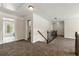 Loft area boasts neutral carpet, decorative railings and trim, and access to other rooms in the home at 2251 Everleigh Ln, Marietta, GA 30064