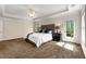 Primary bedroom featuring a tray ceiling and an exterior door that leads to a deck at 2251 Everleigh Ln, Marietta, GA 30064