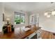 Cozy home office with hardwood floors, large desk, and natural light from a large window at 2251 Everleigh Ln, Marietta, GA 30064